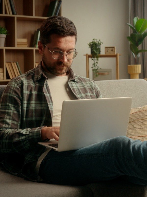 A man selects a dating profile package online and then completes the survey for customization