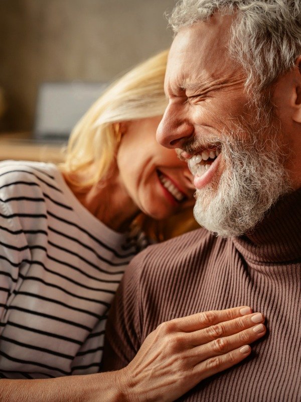 multi-platform-package-premium a couple laughs while embracing